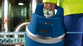 Site contractor carrying portable GENIE gas cylinder